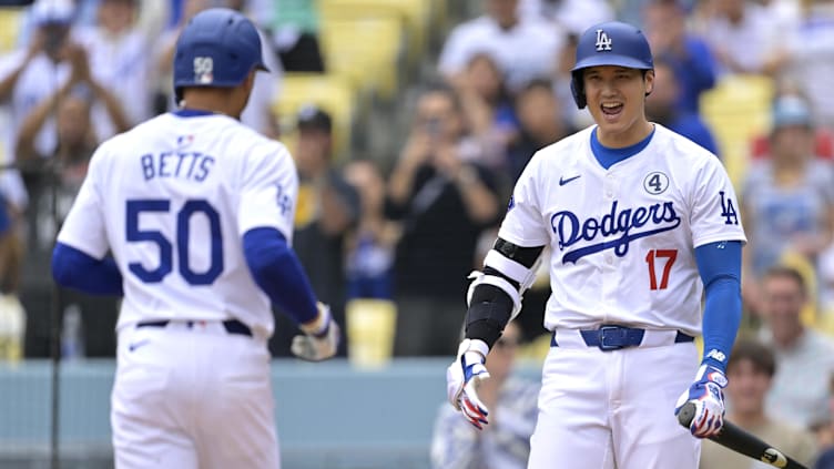 Jun 2, 2024; Los Angeles, California, USA;  Los Angeles Dodgers shortstop Mookie Betts (50) is greeted at the plate by designated hitter player Shohei Ohtani (17). Mandatory Credit: Jayne Kamin-Oncea-USA TODAY Sports