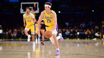 January 15, 2025; Los Angeles, California, USA; Los Angeles Lakers guard Austin Reaves (15) moves the ball against the Miami Heat during the second half at Crypto.com Arena. Mandatory Credit: Gary A. Vasquez-Imagn Images