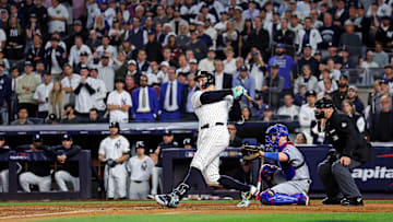 Oct 30, 2024; New York, New York, USA; New York Yankees outfielder Aaron Judge (99) hits a double during the eighth inning against the Los Angeles Dodgers in game four of the 2024 MLB World Series at Yankee Stadium.