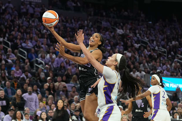 Golden State Valkyries forward Monique Billings shoots against Los Angeles Sparks forward Dearica Hamby. 