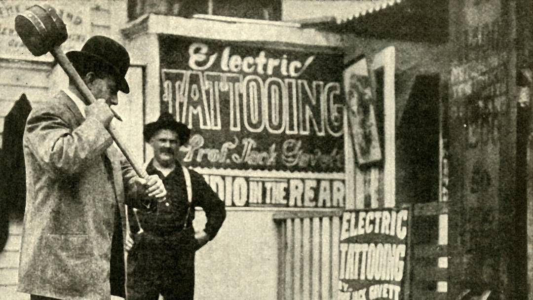 Man playing a game at a fairground in the early 1900s Man playing a game at a fairground in the early 1900s