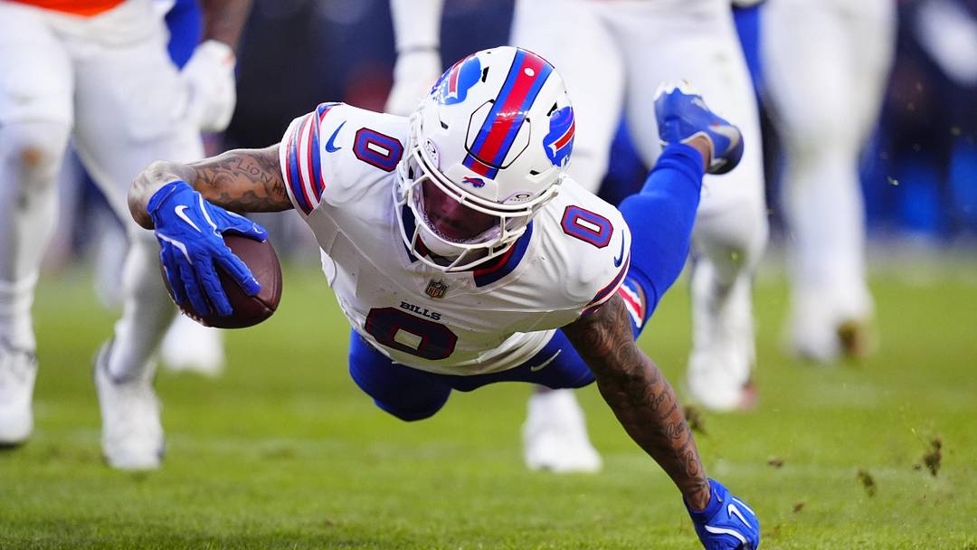 Jan 17, 2026; Denver, CO, USA; Buffalo Bills wide receiver Keon Coleman (0) scores a touchdown during the third quarter of an AFC Divisional Round playoff game against the Denver Broncos at Empower Field at Mile High. Mandatory Credit: Ron Chenoy-Imagn Images