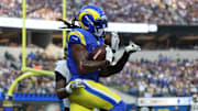 Nov 2, 2025; Inglewood, California, USA; Los Angeles Rams wide receiver Davante Adams (17) makes a touchdown catch in front of New Orleans Saints cornerback Kool-Aid McKinstry (4) during the second half at SoFi Stadium. Mandatory Credit: Kiyoshi Mio-Imagn Images