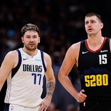 Dec 18, 2023; Denver, Colorado, USA; Dallas Mavericks guard Luka Doncic (77) and Denver Nuggets center Nikola Jokic (15) in the second quarter at Ball Arena. Mandatory Credit: Isaiah J. Downing-Imagn Images