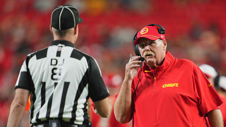 Aug 22, 2024; Kansas City, Missouri, USA; Kansas City Chiefs head coach Andy Reid talks with down judge Dana McKenzie (8) during the second half against the Chicago Bears at GEHA Field at Arrowhead Stadium. Mandatory Credit: Jay Biggerstaff-Imagn Images