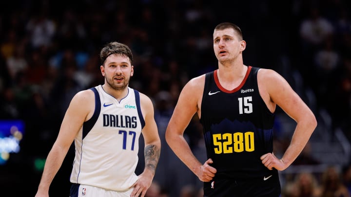 Dec 18, 2023; Denver, Colorado, USA; Dallas Mavericks guard Luka Doncic (77) and Denver Nuggets center Nikola Jokic (15) in the second quarter at Ball Arena. Mandatory Credit: Isaiah J. Downing-USA TODAY Sports