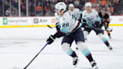 Mar 8, 2025; Philadelphia, Pennsylvania, USA; Seattle Kraken defenseman Josh Mahura (28) controls the puck against the Philadelphia Flyers in the third period at Wells Fargo Center. Mandatory Credit: Kyle Ross-Imagn Images