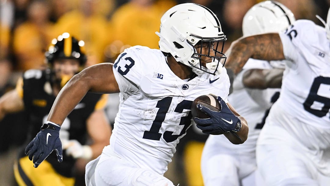 Oct 18, 2025; Iowa City, Iowa, USA; Penn State Nittany Lions running back Kaytron Allen (13) runs the ball against the Iowa Hawkeyes during the second quarter at Kinnick Stadium. Mandatory Credit: Jeffrey Becker-Imagn Images Oct 18, 2025; Iowa City, Iowa, USA; Penn State Nittany Lions running back Kaytron Allen (13) runs the ball against the Iowa Hawkeyes during the second quarter at Kinnick Stadium. Mandatory Credit: Jeffrey Becker-Imagn Images
