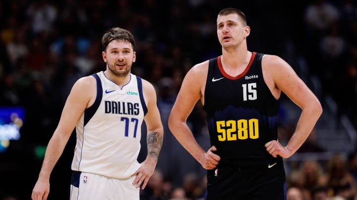 Dec 18, 2023; Denver, Colorado, USA; Dallas Mavericks guard Luka Doncic (77) and Denver Nuggets center Nikola Jokic (15) in the second quarter at Ball Arena. Mandatory Credit: Isaiah J. Downing-USA TODAY Sports