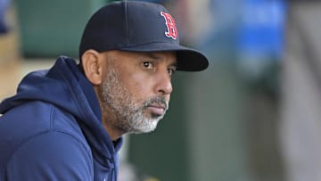 Boston Red Sox manager Alex Cora (13) sits in the dugout before the game against the Los Angeles Angels at Angel Stadium. 