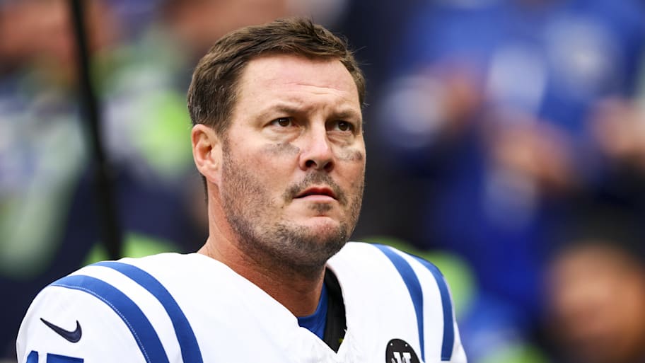 Philip Rivers looks ahead without a helmet on.