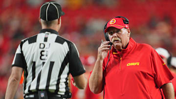 Aug 22, 2024; Kansas City, Missouri, USA; Kansas City Chiefs head coach Andy Reid talks with down judge Dana McKenzie (8) during the second half against the Chicago Bears at GEHA Field at Arrowhead Stadium. Mandatory Credit: Jay Biggerstaff-Imagn Images