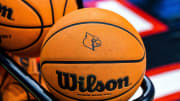 A basketball with the Louisville logo.