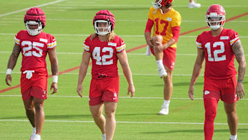 Jul 22, 2025; St. Joseph, MO, USA; Kansas City Chiefs running back Elijah Mitchell (25) and running back Carson Steele (42) and tight end Jared Wiley (12) on field during training camp at Missouri Western State University. Mandatory Credit: Denny Medley-Imagn Images