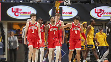 Jan 7, 2025; Morgantown, West Virginia, USA; Arizona Wildcats players break from a huddle during the first half against the West Virginia Mountaineers at WVU Coliseum. Mandatory Credit: Ben Queen-Imagn Images
