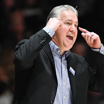 Purdue Boilermakers head coach Matt Painter gestures to his team 