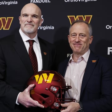 Feb 5, 2024; Ashburn, VA, USA; Washington Commanders head coach Dan Quinn (L) poses for a picture with Commanders managing partner Josh Harris (R) at Quinn's introductory press conference at Commanders Park. Mandatory Credit: Geoff Burke-USA TODAY Sports