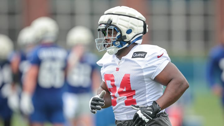 Jul 24, 2024; East Rutherford, NJ, USA; New York Giants defensive tackle Elijah Chatman (94) runs on the field during training camp at Quest Diagnostics Training Facility.  