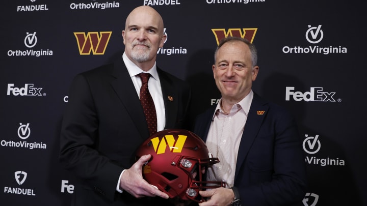 Feb 5, 2024; Ashburn, VA, USA; Washington Commanders head coach Dan Quinn (L) poses for a picture