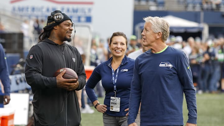 Seattle Seahawks head coach Pete Carroll speaks with Oakland Raiders running back Marshawn Lynch. Seattle Seahawks head coach Pete Carroll speaks with Oakland Raiders running back Marshawn Lynch.