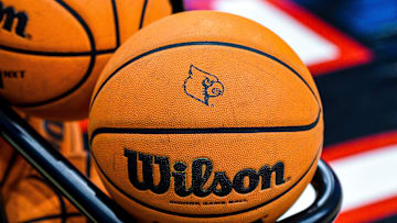 A basketball emblazoned with the Louisville logo