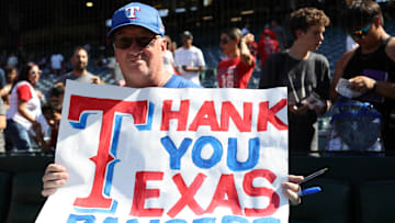 Sep 29, 2024; Anaheim, California, USA;  A Texas Rangers fan shows a sign board after a MLB game between the Los Angeles Angels and the Texas Rangers at Angel Stadium. 