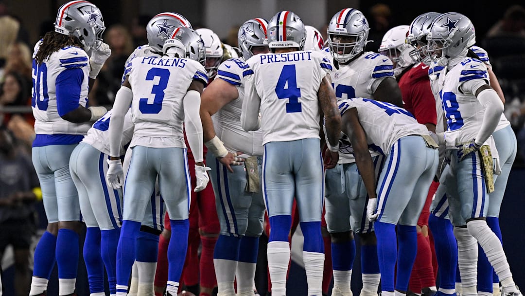 Dallas Cowboys quarterback Dak Prescott huddles with the offense during the game against the Arizona Cardinals. Dallas Cowboys quarterback Dak Prescott huddles with the offense during the game against the Arizona Cardinals.