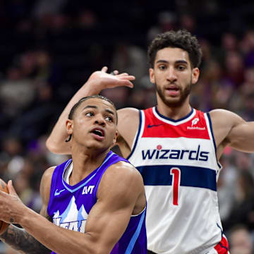 Mar 19, 2025; Salt Lake City, Utah, USA;  Utah Jazz guard Keyonte George (3) makes move around Washington Wizards guard Colby Jones (1) during the second half at the Delta Center. Mandatory Credit: Peter Creveling-Imagn Images