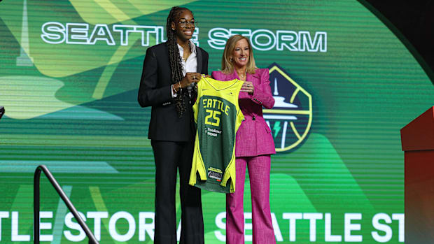 Dominique Malonga poses with WNBA commissioner Cathy Engelbert after being selected by the Seattle Storm in 2025 WNBA draft.