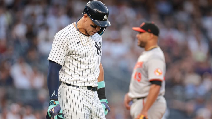 Jun 18, 2024; Bronx, New York, USA; New York Yankees center fielder Aaron Judge (99) walks first base after being hit by a pitch during the third inning by Baltimore Orioles starting pitcher Albert Suarez (49) at Yankee Stadium. Mandatory Credit: Vincent Carchietta-USA TODAY Sports