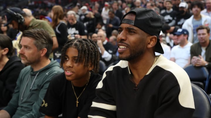 Apr 23, 2024; Los Angeles, California, USA; Chris Paul (right) attends game two of the first round for the 2024 NBA playoffs between the Los Angeles Clippers and the Dallas Mavericks at Crypto.com Arena. Mandatory Credit: Kiyoshi Mio-USA TODAY Sports