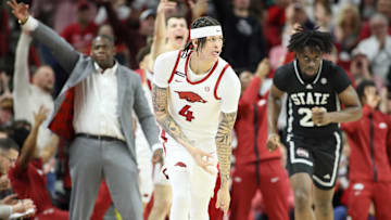Mar 8, 2025; Fayetteville, Arkansas, USA; Arkansas Razorbacks forward Trevon Brazile (4) reacts after making a three point shot in the second half against the Mississippi State Bulldogs at Bud Walton Arena. Arkansas won 93-92. Mandatory Credit: Nelson Chenault-Imagn Images