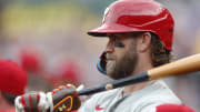 Jul 20, 2024; Pittsburgh, Pennsylvania, USA;  Philadelphia Phillies first baseman Bryce Harper (3) waits to bat in the dugout against the Pittsburgh Pirates during the first inning at PNC Park. Mandatory Credit: Charles LeClaire-USA TODAY Sports