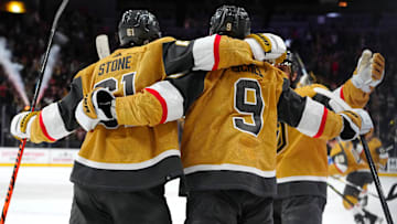 Dec 12, 2023; Las Vegas, Nevada, USA; Vegas Golden Knights right wing Mark Stone (61) celebrates with Vegas Golden Knights center Jack Eichel (9) after scoring a goal against the Calgary Flames in an overtime period to give the Golden Knights a 5-4 victory at T-Mobile Arena. Mandatory Credit: Stephen R. Sylvanie-Imagn Images