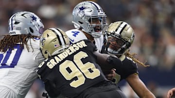 Sep 15, 2024; Arlington, Texas, USA; Dallas Cowboys quarterback Dak Prescott (4) is sacked by New Orleans Saints defensive end Carl Granderson (96) in the second half at AT&T Stadium. Mandatory Credit: Tim Heitman-Imagn Images