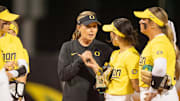 Oregon coach Melyssa Lombardi talks to players as the Oregon Ducks host the UCLA Bruins on April 18, 2025, at Jane Sanders Stadium in Eugene.