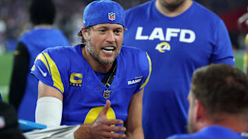 Los Angeles Rams quarterback Matthew Stafford (9) reacts on the bench against the Minnesota Vikings during the first half in an NFC wild card game at State Farm Stadium.