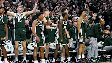 Jan 9, 2025; East Lansing, Michigan, USA;  The Michigan State Spartans bench reacts after Nick Sanders scores late in the game against the Washington Huskies at Jack Breslin Student Events Center. Mandatory Credit: Dale Young-Imagn Images