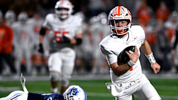Celina quarterback Bowe Bentley scrambles with the ball during the Bobcats’ Class 4A Div. I semi-final game against West Plains in Abilene Dec. 13, 2024. Final score was 43-36, Celina.