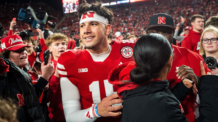 Dylan Raiola walks off as fans rush the field after defeating the Wisconsin Badgers at Memorial Stadium. Dylan Raiola walks off as fans rush the field after defeating the Wisconsin Badgers at Memorial Stadium.