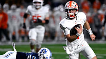Celina quarterback Bowe Bentley scrambles with the ball during the Bobcats’ Class 4A Div. I semi-final game against West Plains in Abilene Dec. 13, 2024. Final score was 43-36, Celina.
