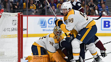 Nov 11, 2024; Denver, Colorado, USA; Nashville Predators goaltender Juuse Saros (74) makes a save in traffic during the second period against the Colorado Avalanche at Ball Arena. Mandatory Credit: Christopher Hanewinckel-Imagn Images