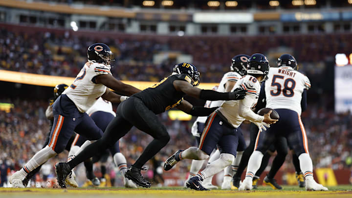 Caleb Williams attempts to scramble away last year in the Hail Mary game with Washington. Caleb Williams attempts to scramble away last year in the Hail Mary game with Washington.