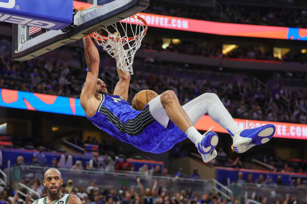 Orlando Magic guard Jalen Suggs (4) dunks.