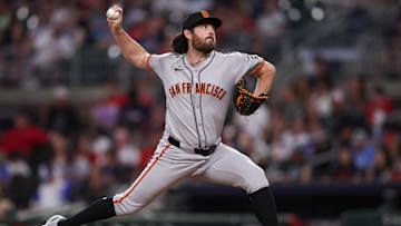 Jul 21, 2025; Atlanta, Georgia, USA; San Francisco Giants relief pitcher Ryan Walker (74) throws against the Atlanta Braves in the sixth inning at Truist Park. Mandatory Credit: Brett Davis-Imagn Images