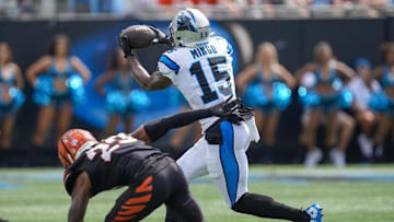 Sep 29, 2024; Charlotte, North Carolina, USA; Carolina Panthers wide receiver Jonathan Mingo (15) makes a catch defended by Cincinnati Bengals cornerback Dax Hill (23) during the second quarter at Bank of America Stadium. Mandatory Credit: Jim Dedmon-Imagn Images