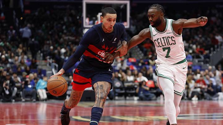 Nov 22, 2024; Washington, District of Columbia, USA; Washington Wizards forward Kyle Kuzma (33) drives to the basket as Boston Celtics guard Jaylen Brown (7) defends in the second half at Capital One Arena. Mandatory Credit: Geoff Burke-Imagn Images