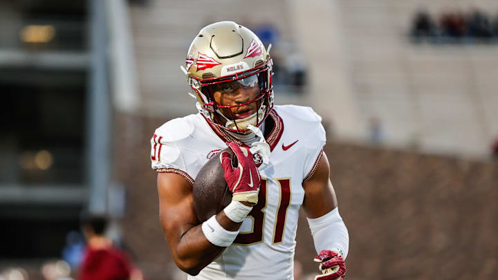 Oct 18, 2024; Durham, North Carolina, USA;  Florida State Seminoles linebacker DeMarco Ward (31) runs with the football prior to the first half of the game against Duke Blue Devils at Wallace Wade Stadium. Mandatory Credit: Jaylynn Nash-Imagn Images