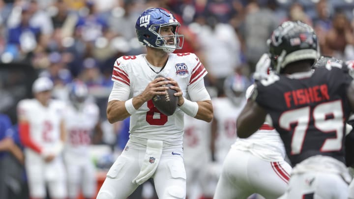 Aug 17, 2024; Houston, Texas, USA; New York Giants quarterback Daniel Jones (8) looks for an open receiver during the second quarter against the Houston Texans at NRG Stadium.  