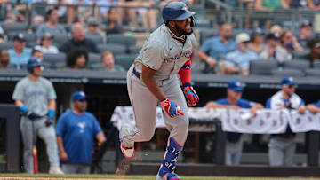 Aug 4, 2024; Bronx, New York, USA; Toronto Blue Jays first baseman Vladimir Guerrero Jr. (27) doubles during the third inning against the New York Yankees at Yankee Stadium. Mandatory Credit: Vincent Carchietta-USA TODAY Sports